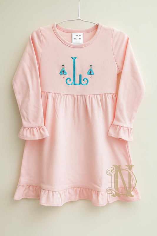 Monogram Long Sleeve Ruffle Dress with Clara holding Nutcracker